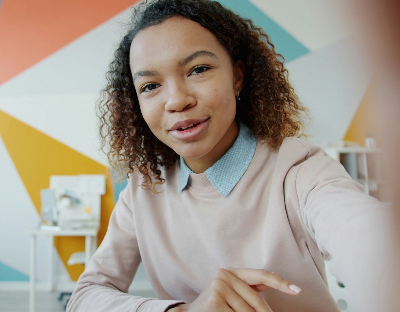 A smiling learner on a live CADI video session