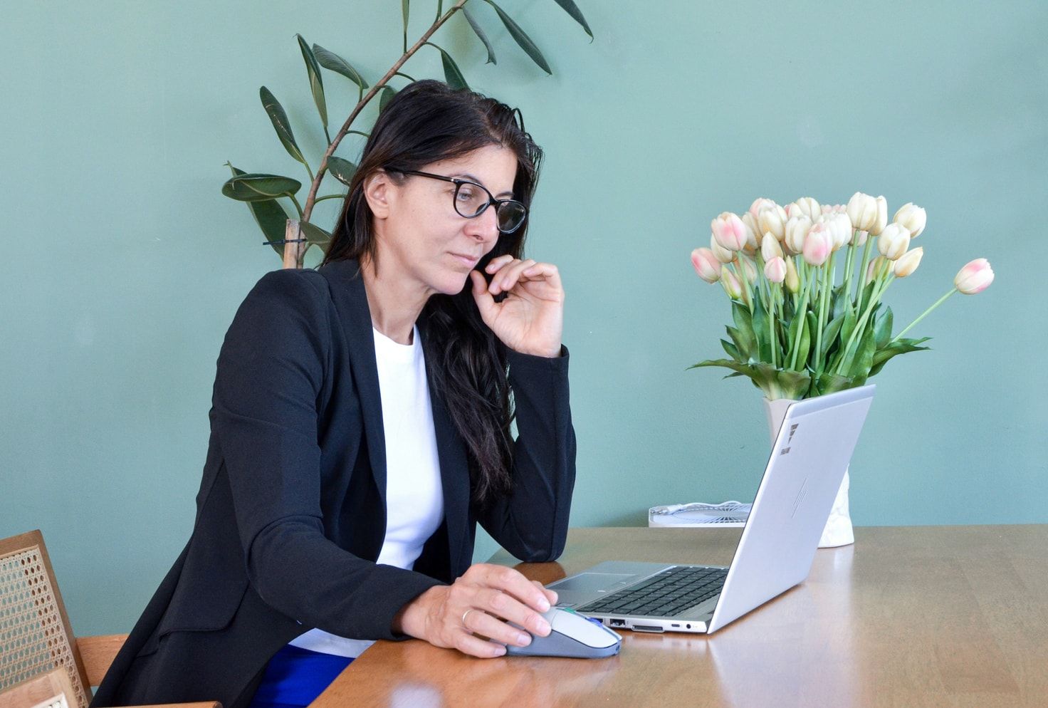 A security lead reviewing CADI access settings at her desk